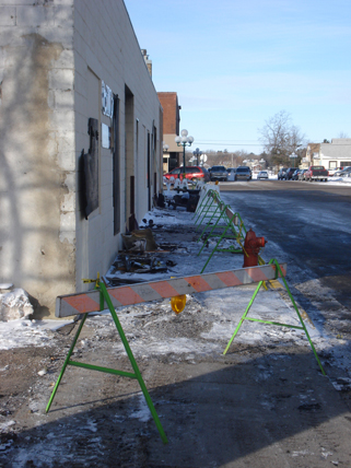 View of the sidewalk after the fire, Bills Decorating & Iron Hills Pawn Shop, Little Falls, MN, January 26, 2010. Theres evidence of fire damage on the sidewalk. View of the sidewalk after the fire, Bills Decorating & Iron Hills Pawn Shop, Little Falls, MN, January 26, 2010. Theres evidence of fire damage on the sidewalk.