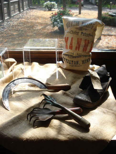 http://www.morrisoncountyhistory.org/museumpics/buildex13.jpg A sickle joins the rakes and boot.